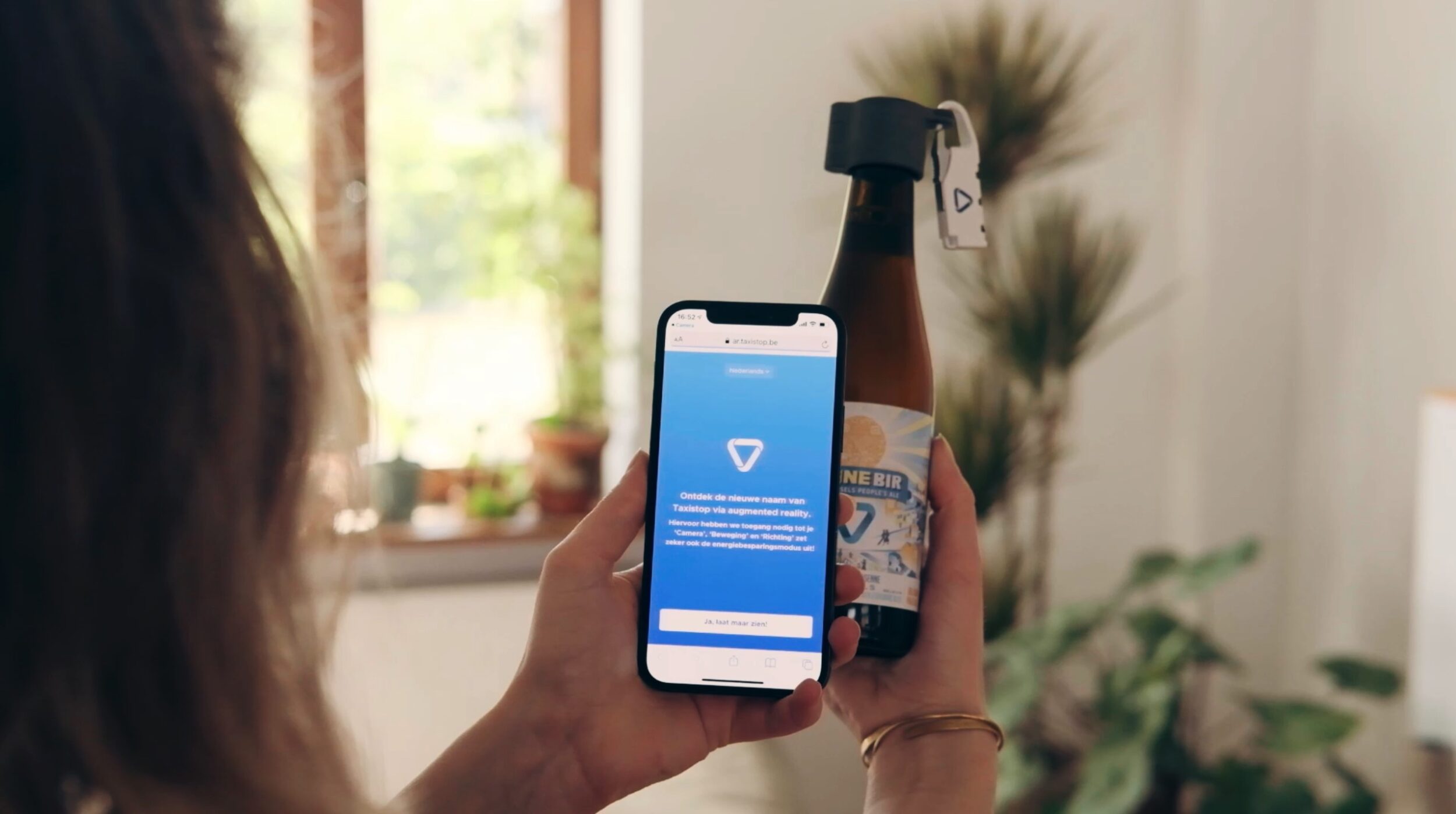 Seeing double: transforming Taxistop into Mpact through augmented reality on a bottle